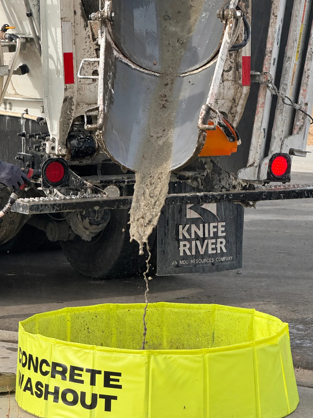 Knife River washout operation — concrete discharge close-up